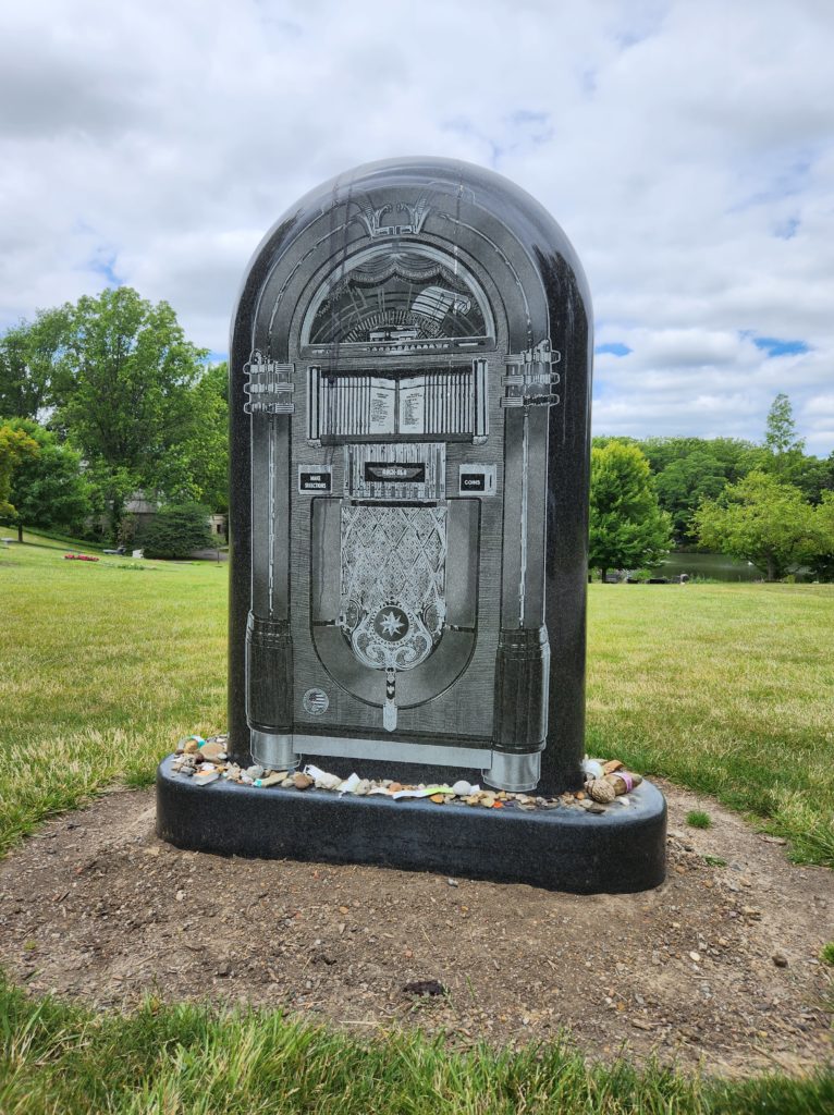 The tombstone of Alan Freed, man who coined the term "Rock and Roll", that is carved to look like a jukebox. Located in the Lake View Cemetery.