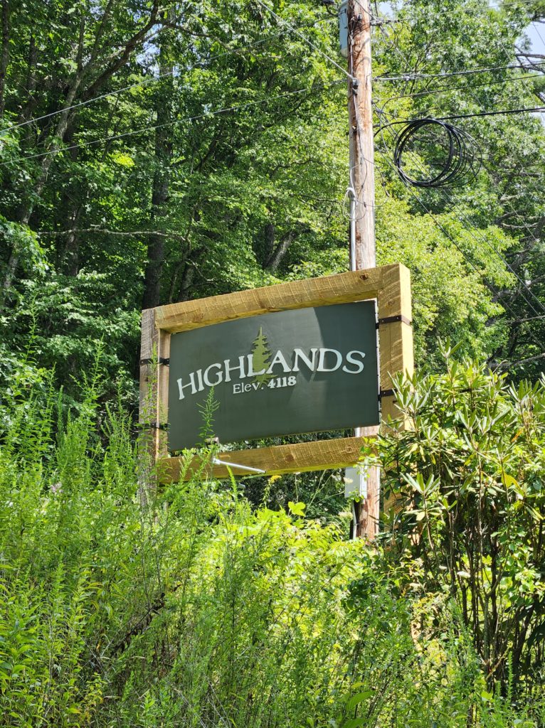 A sign that reads "Highlands Elevation 4118".